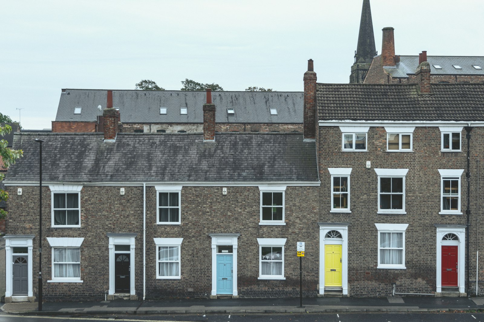 A terrace of English houses with painted front doors