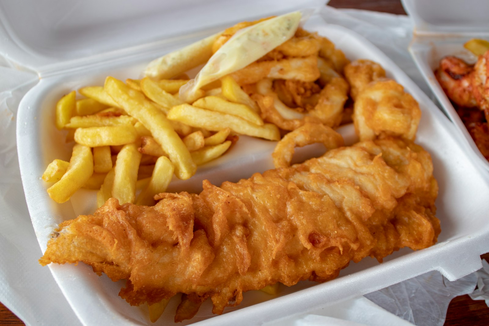 Fish and chips in a takeaway tray
